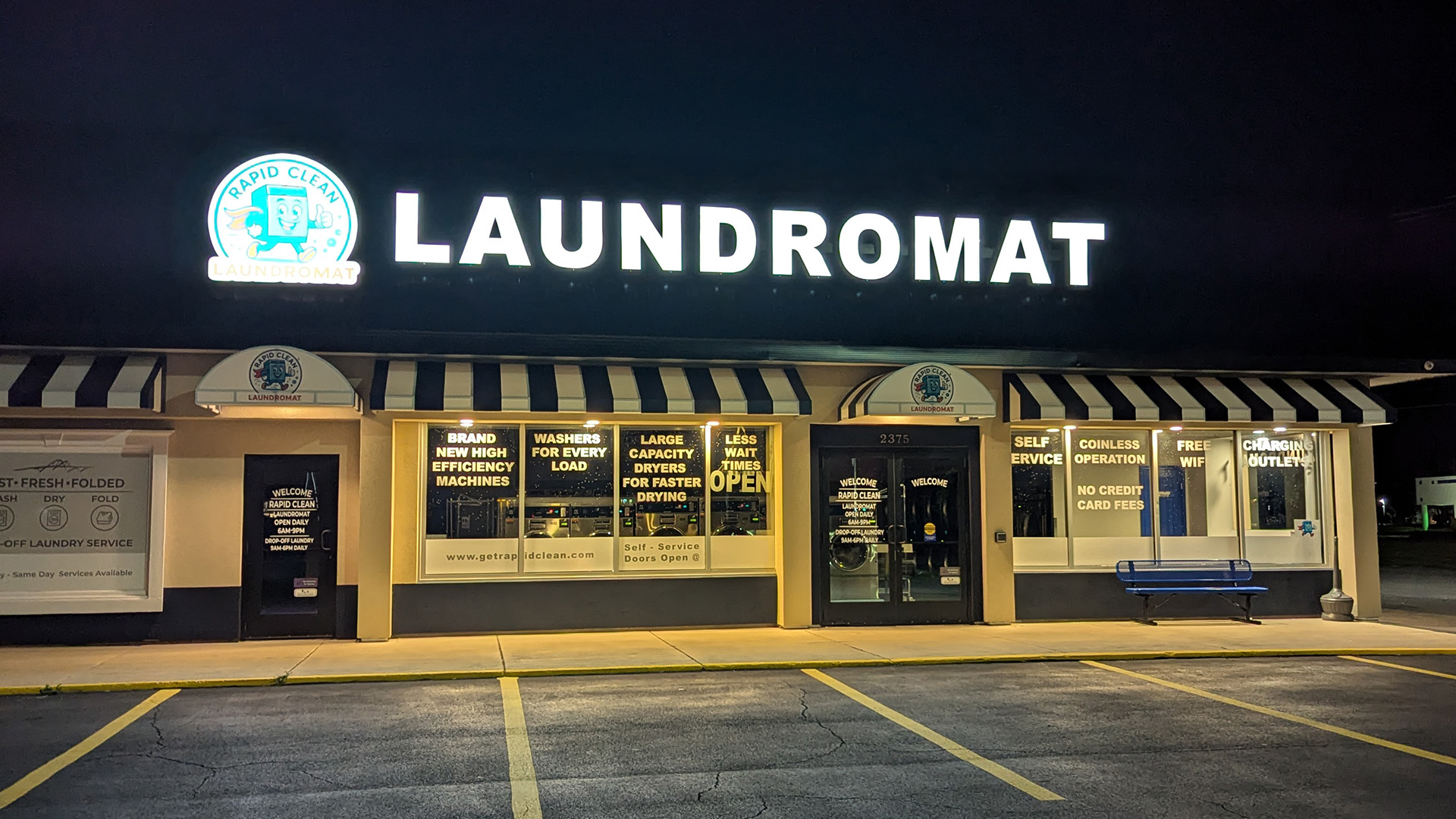 Rapid Clean Laundromat storefront night
